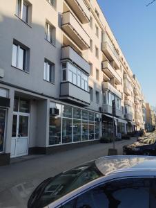 a car parked in front of a building at Kawalerka in Gdynia
