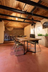 a large wooden table in a room with chairs at Herberg 't Molenhuis in Vichte