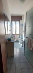 a bathroom with a sink and a toilet at Margot's House Rho in Rho +33 photos