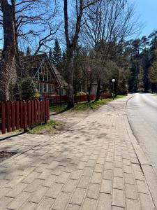 an empty road in front of a house at RestMax in Nida