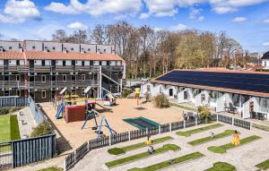 an aerial view of a playground in front of a building at Awesome Apartment In Faaborg With Sauna in Faaborg