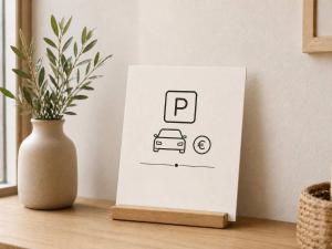 a white card with a car on a table at Èrsextius, MJD, Aix-en-Provence in Aix-en-Provence