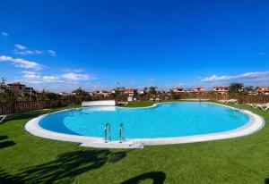 a large swimming pool in the middle of a yard at Villa Twins in Lajares