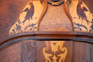 a wooden door with birds painted on it at The Avalon Hotel - Altstadt Schwerin in Schwerin