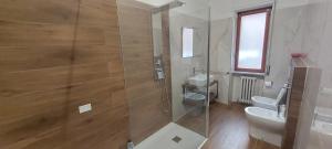 a bathroom with a shower and a toilet and a sink at B&B Le Ortensie in Cosenza +25 photos