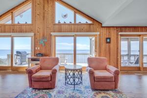 two chairs and a table in a room with windows at 7815 - Tarhoo in Frisco