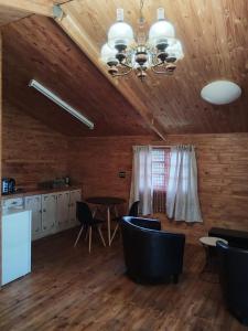 a dining room with a table and chairs and a ceiling at Greenstone Guesthouse in Muldersdrift