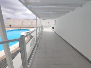 a view from the balcony of a building with a swimming pool at Sea View Colony Club in Puerto del Carmen