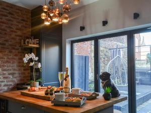 a kitchen with a table with food on it at Copper Cottage in Morpeth
