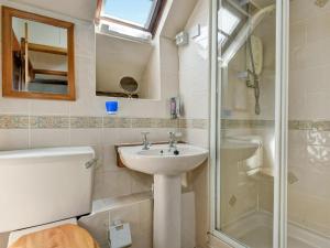 a bathroom with a toilet and a sink and a shower at Bossington- Ukc4921 in Timberscombe