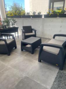 a group of chairs and tables on a patio at pinetadamare in Porto SantʼElpidio