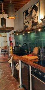 a kitchen with a counter top with a sink at A Toca, Complete townhouse apartment in Monchique