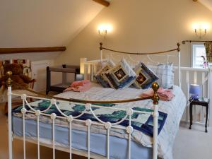 a bedroom with a white bed with pillows at The Old King's Head Pickering in Pickering