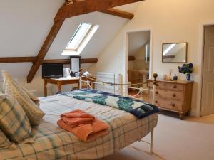 a bedroom with a bed with towels on it at The Old King's Head Pickering in Pickering