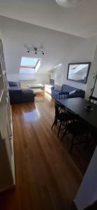a living room with a couch and a table at A&M Real Estate in Milladoiro