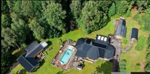 an aerial view of a house with a swimming pool at Black Pearl in Höjaholm