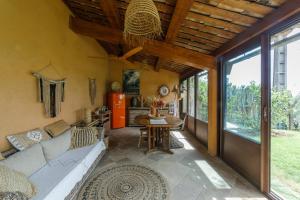 a living room with a couch and a table at Mas de l'Olivette in Cotignac