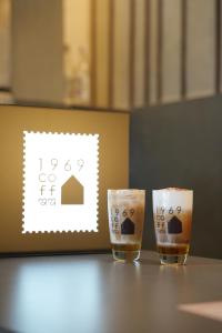 two glasses sitting on top of a table at Hotel Shri Ram Residency in Belgaum +6 photos