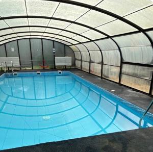 a large swimming pool inside of a building at Melrose in Lancaster