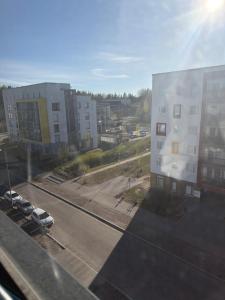 a view of a city with buildings and a street at Urban Pair Luxe Suites in Vantaa