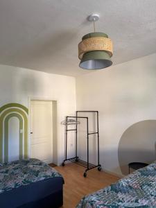 a room with two beds and a light at Dianas Ferienwohnung 2 in Feldberg