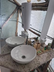 a bathroom with two sinks on a counter at Bamboo glamping in Kotor +9 photos