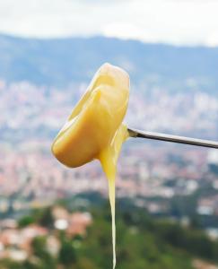 a drop of honey dripping from a wire at Hostal Del Cielo in Medellín