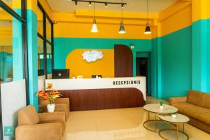 a lobby with a reception desk in a building at INSTAY Hotel Dieng Chill Serenity in Garung