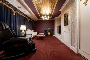 a living room with a couch and a fireplace at Hotel Pharaoh-Adult Only in Sapporo