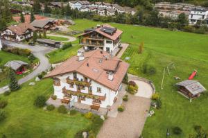 an aerial view of a large house with a yard at Chalet Bel Plan in Ortisei