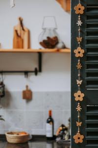 a kitchen with a shelf with a bottle of wine at L'envol des oies in Braives
