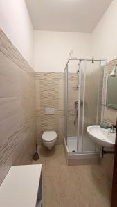 a bathroom with a shower and a toilet and a sink at La casa al mare in Grottammare