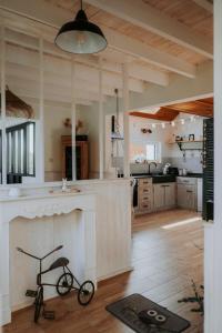 a kitchen with a bike sitting on the floor at L'envol des oies in Braives