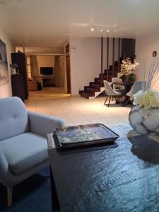 a living room with a couch and a table at Colina de Picoutos Moradia com piscina in Póvoa de Lanhoso