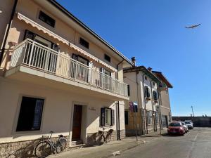 two bikes parked outside of a building on a street at Villa Franca in Grado