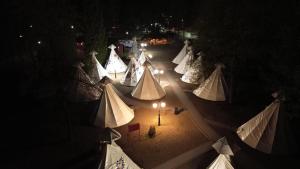 an overhead view of a group of tents at night at Wioska Indiańska River Park Zator SPA RESORT in Zator