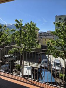 a balcony with cars parked in a parking lot at Il Ciano in Sondrio