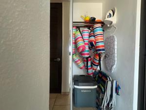 a closet with striped socks and a trash can at Seaside Villa Culebra in Culebra +9 photos
