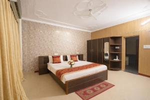 a bedroom with a large bed in a room at The Royal Palace in Lucknow