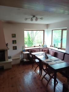 a living room with a table and a couch at Villa Lavandula in Malko Trŭnovo