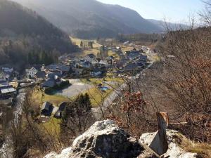 a small town in a valley with houses at CozyNest in Kamna Gorica
