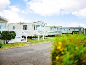 a row of houses on the side of a road at Merryfield and Sandfields in Chapel Saint Leonards
