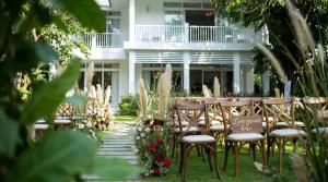 a set up for a wedding in front of a house at Luxury Private Pool Villas at Village Danang Resort in Danang +68 photos