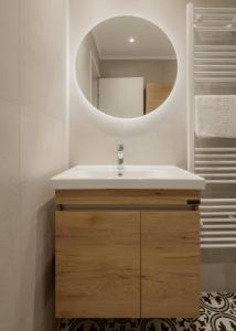 a bathroom with a sink and a mirror at Mediterranean Haven in Paleokastritsa