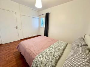 a bedroom with a bed and a window at Teleferico Center Funchal in Funchal