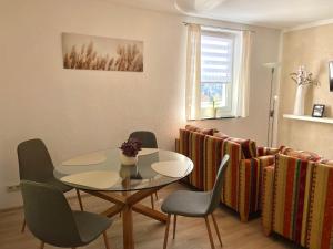 a dining room with a table and chairs at Ferienapartments Erzpanorama in Johanngeorgenstadt