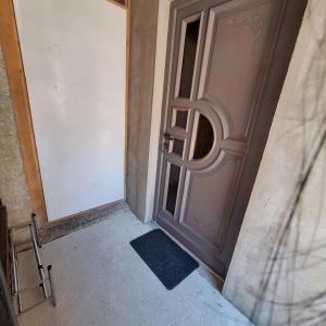 a door with a window in a room at CozyNest in Kamna Gorica