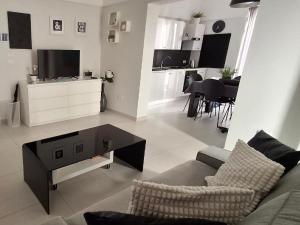 a living room with a couch and a coffee table at Casa Margherita in Noci