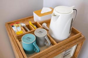 a tray with a blender and mugs in it at Pastell Oldtown Chiang Mai in Chiang Mai +119 photos