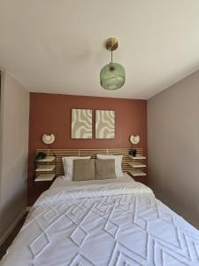 a bedroom with a large white bed in it at Beautiful cocooning appartement in La Chapelle-sur-Erdre